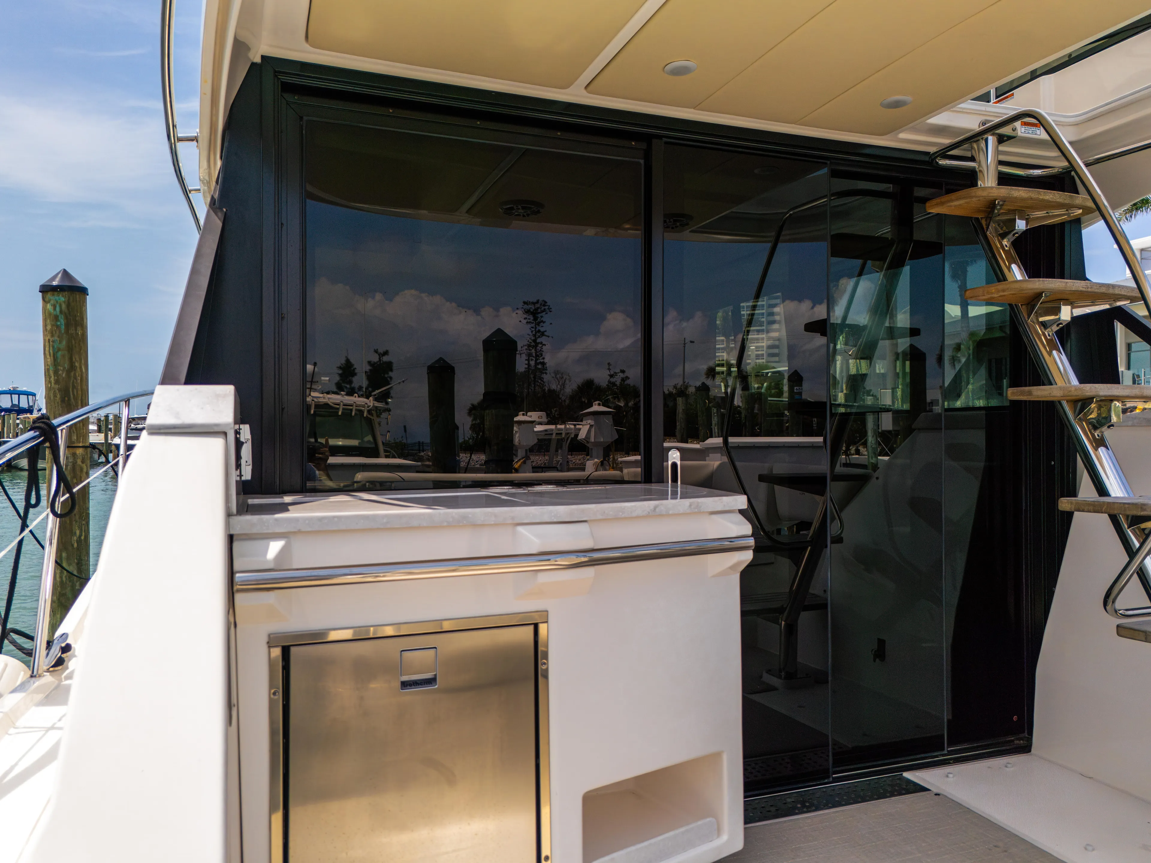  Yacht Photos Pics 2023 Regal 38 FXO yacht with sleek outdoor kitchen and modern design.