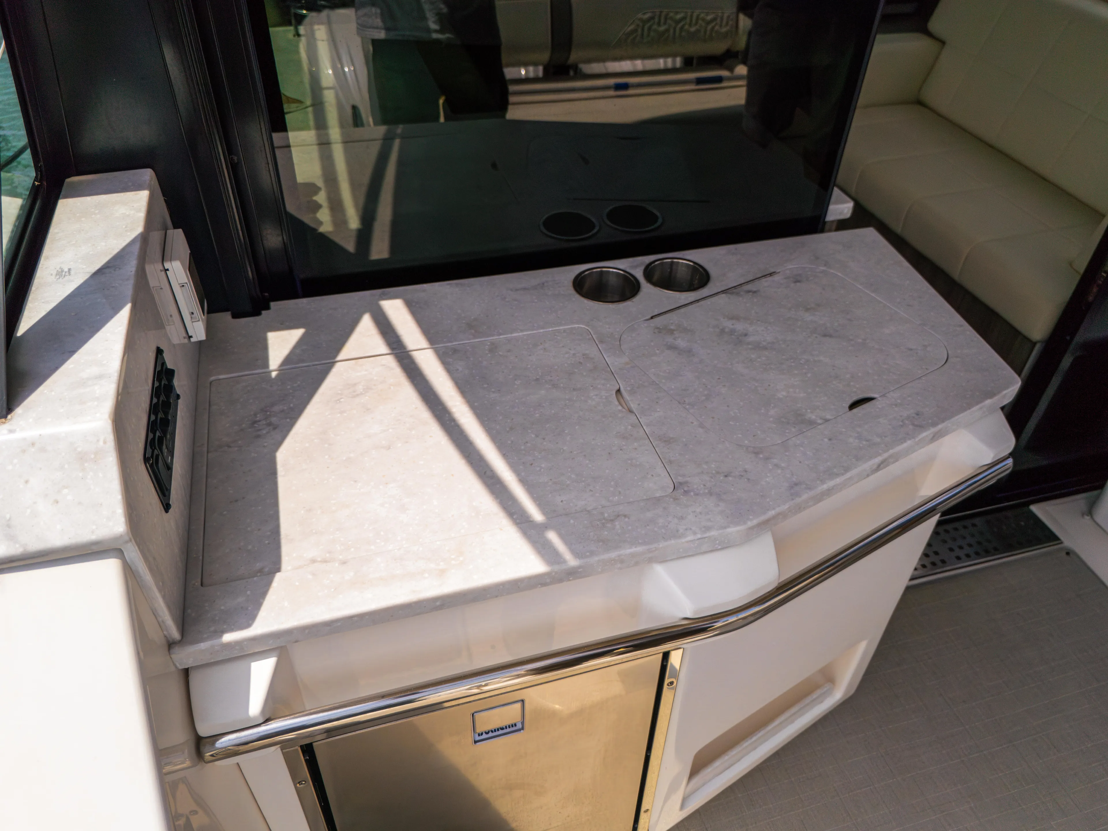  Yacht Photos Pics 2023 Regal 38 FXO yacht kitchenette with countertop and cup holders.