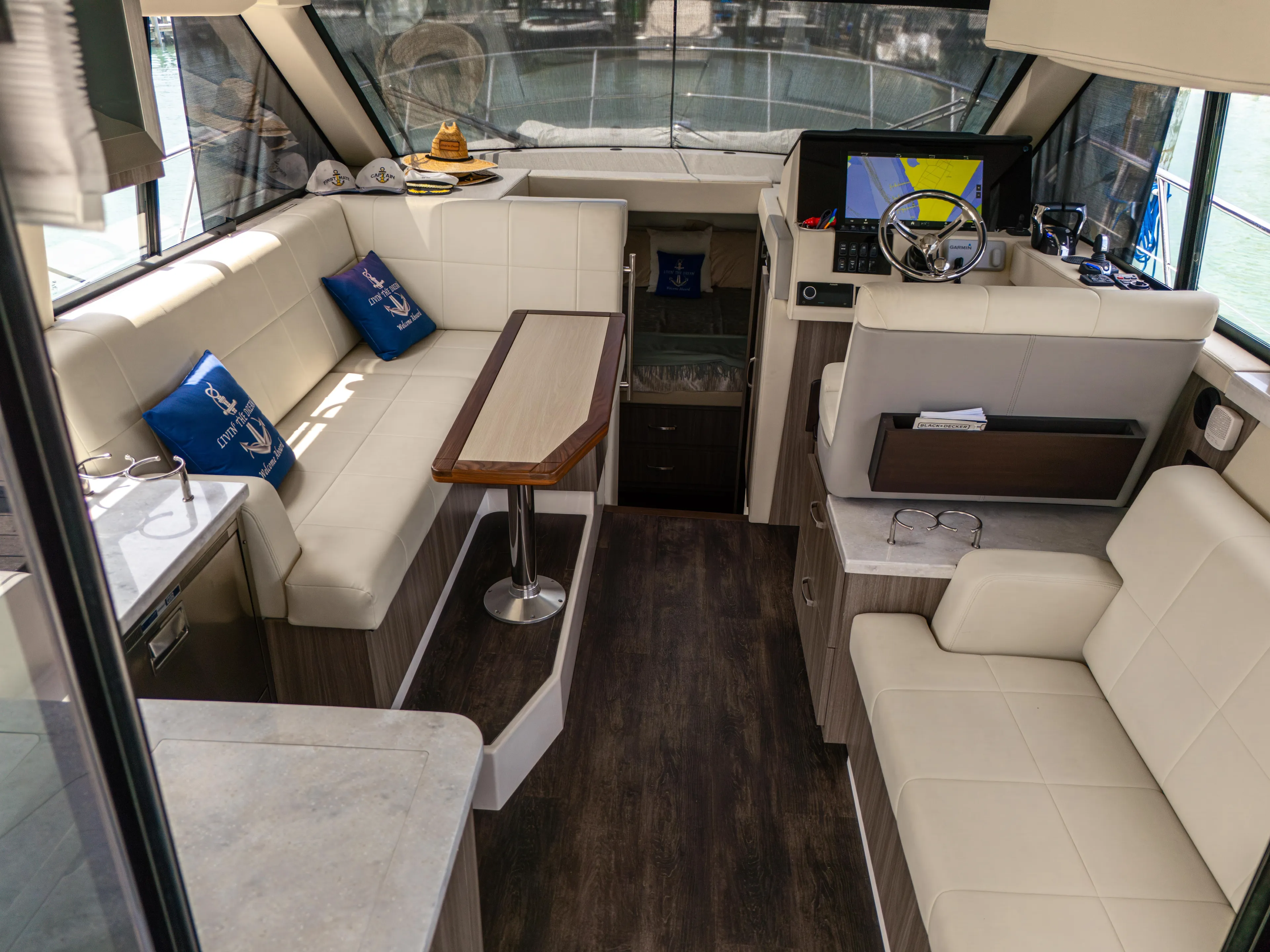  Yacht Photos Pics Luxurious interior of 2023 Regal 38 FXO yacht with plush seating and modern helm.