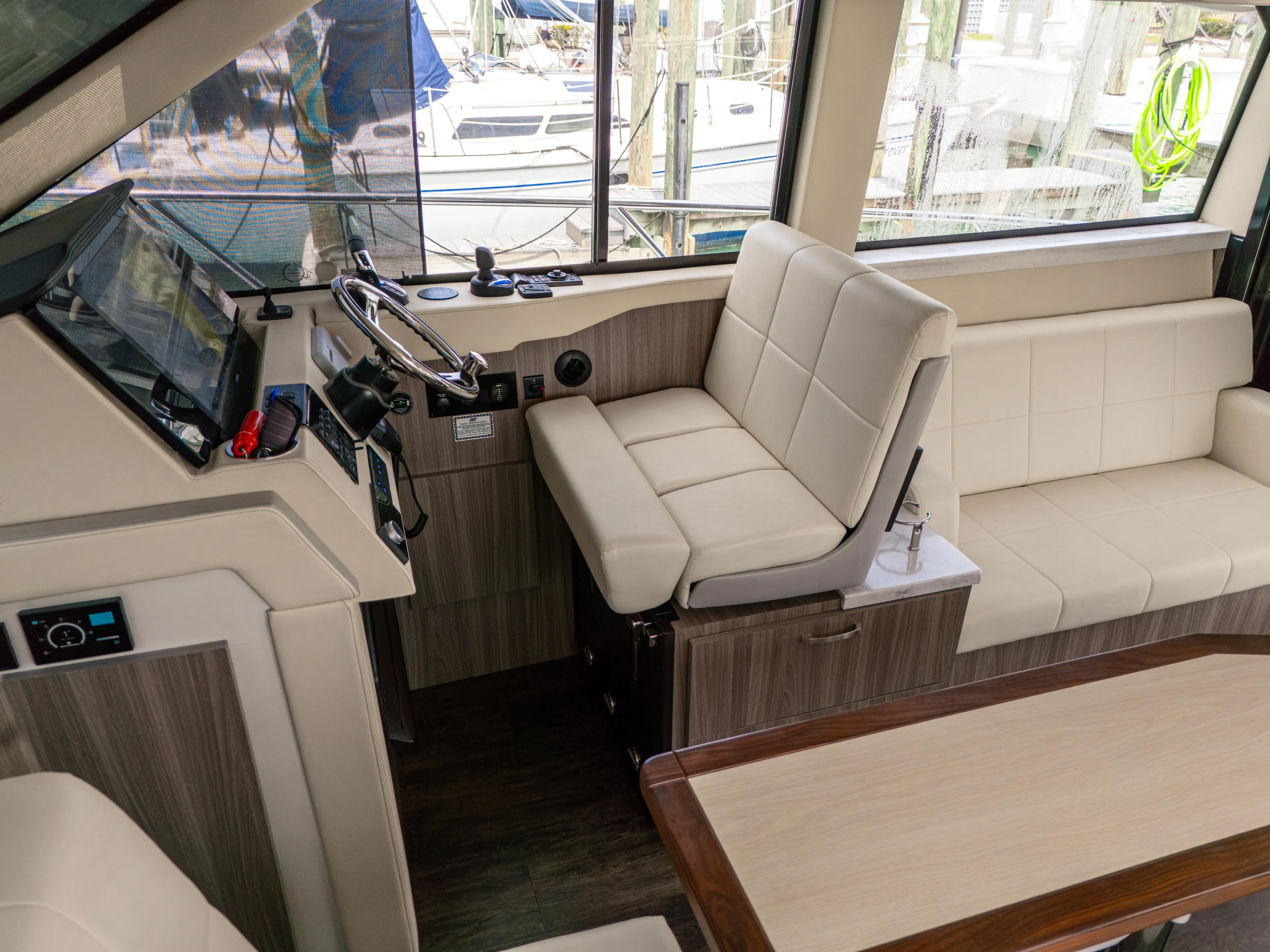  Yacht Photos Pics 2023 Regal 38 FXO boat interior with modern helm and seating area.