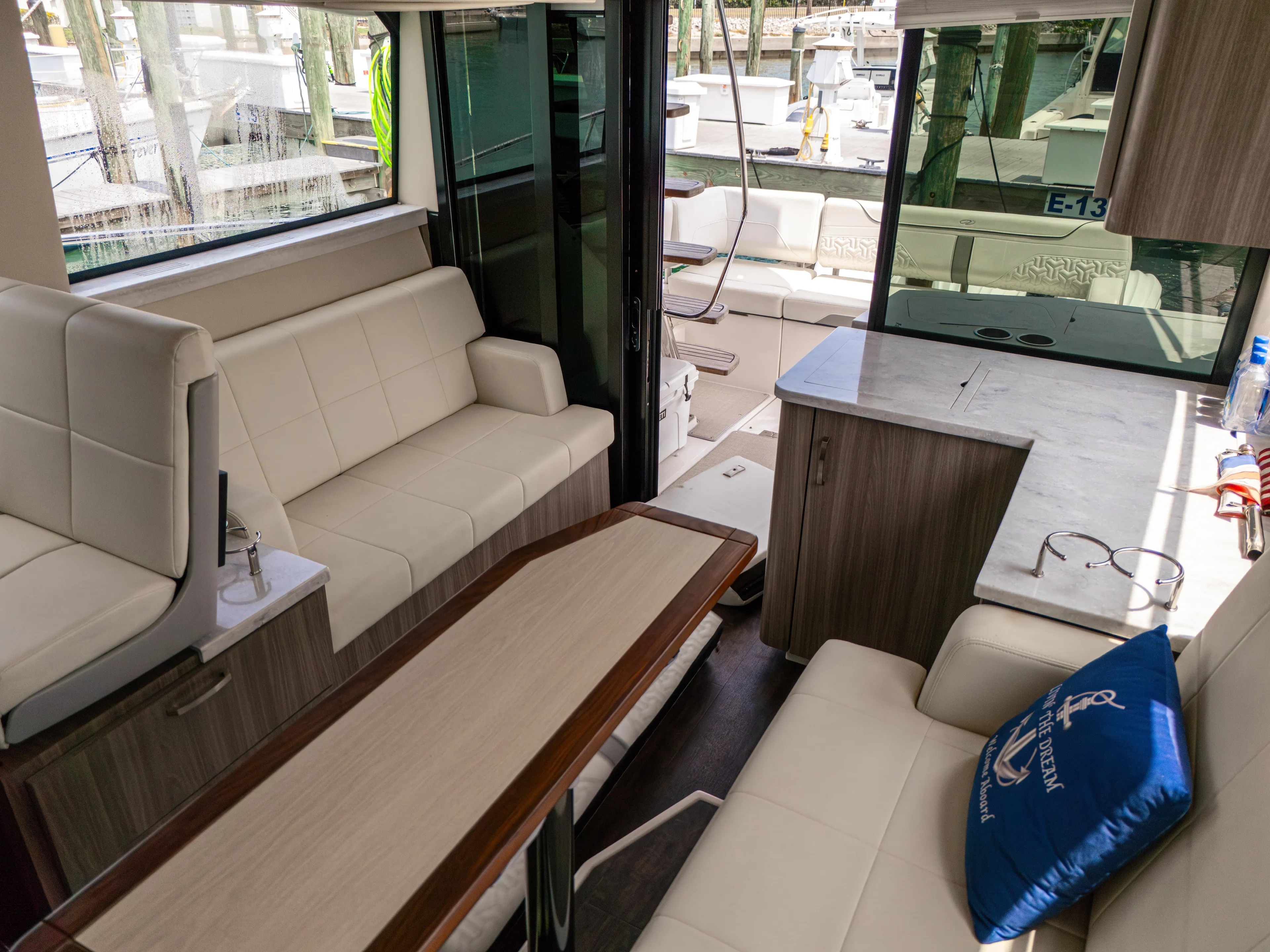  Yacht Photos Pics Luxurious interior of 2023 Regal 38 FXO yacht with modern seating and elegant design.