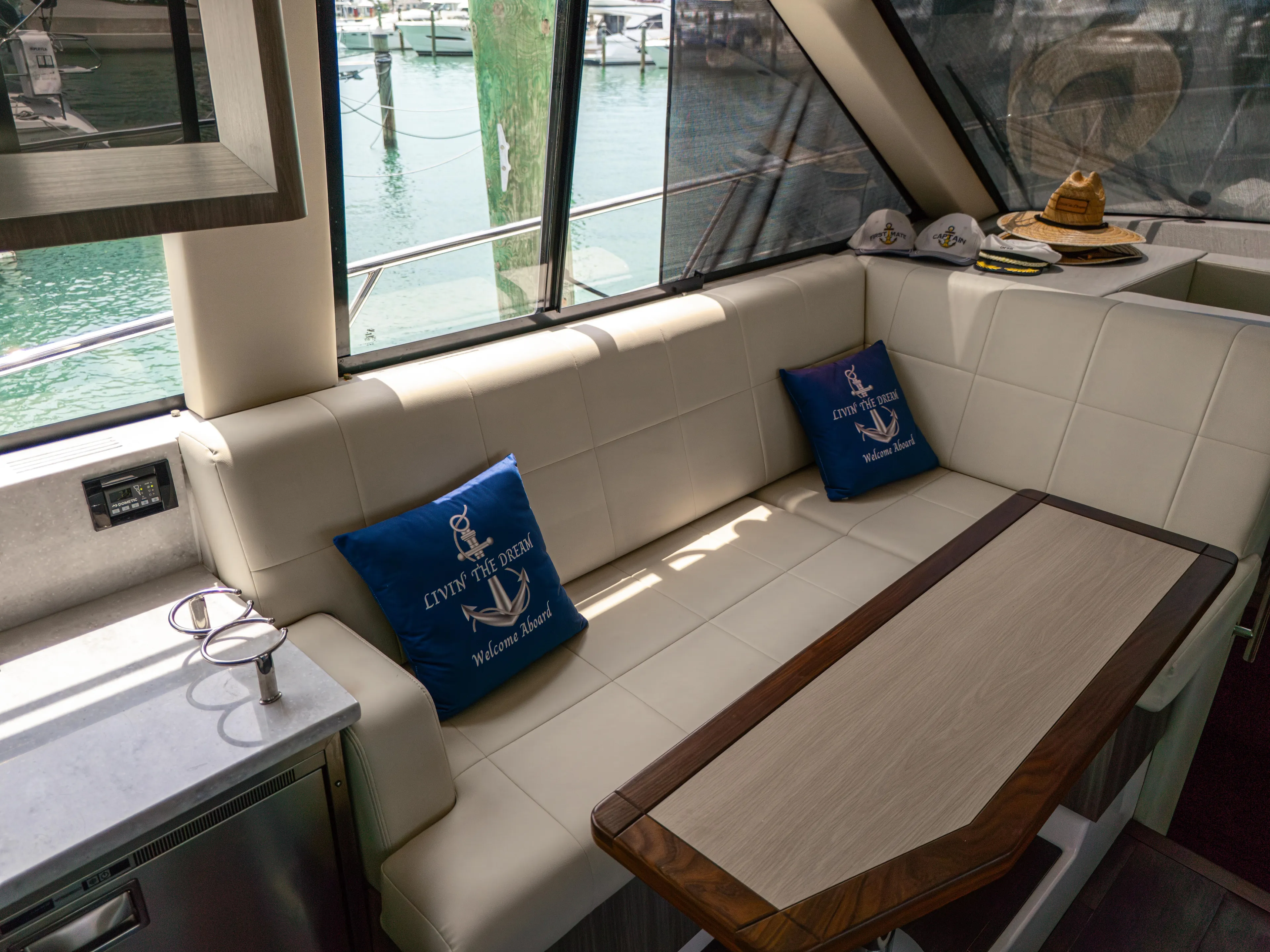  Yacht Photos Pics Luxurious interior of 2023 Regal 38 FXO yacht with plush seating and nautical decor.