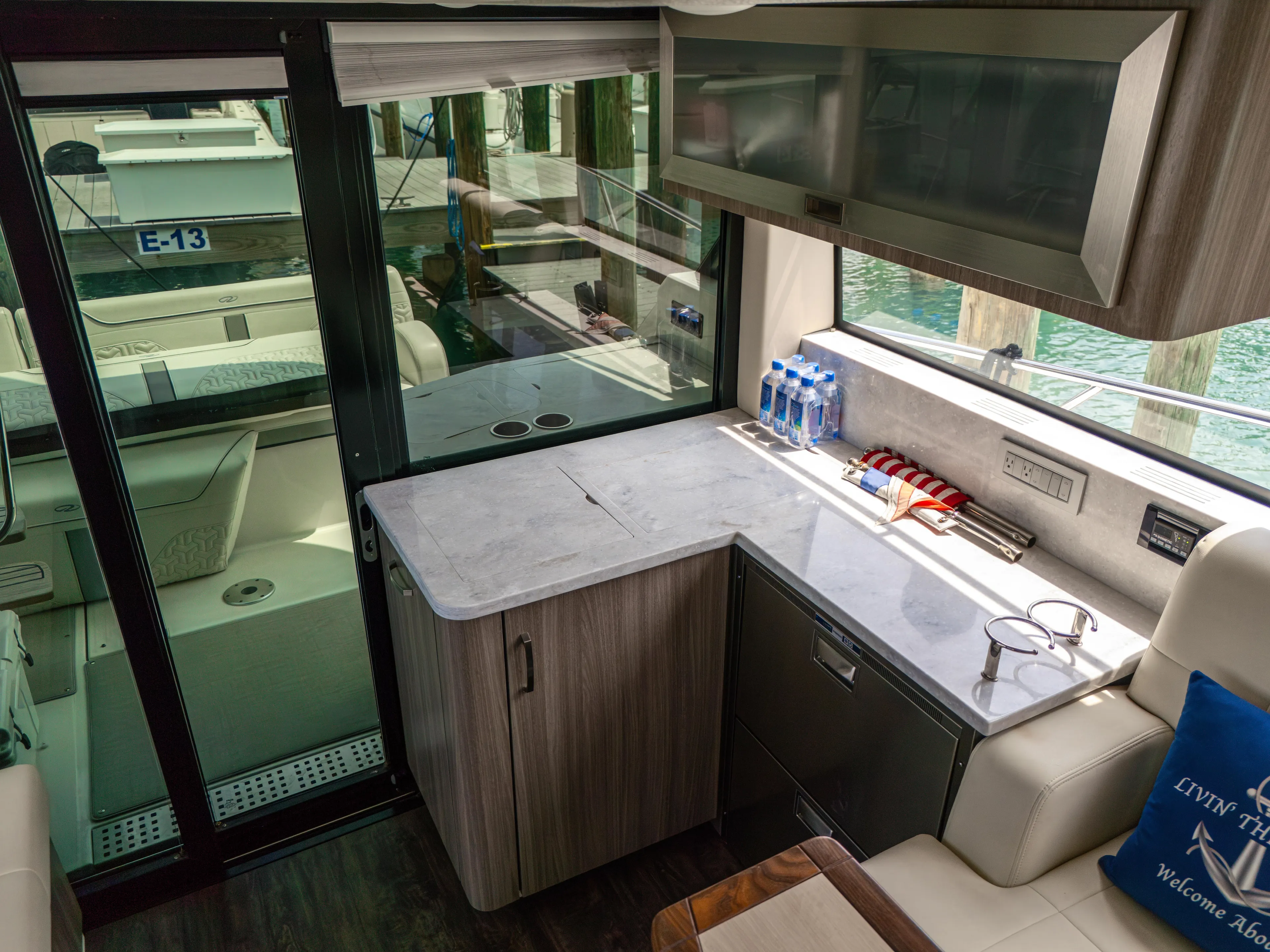  Yacht Photos Pics Interior of 2023 Regal 38 FXO yacht with modern kitchen and seating area.