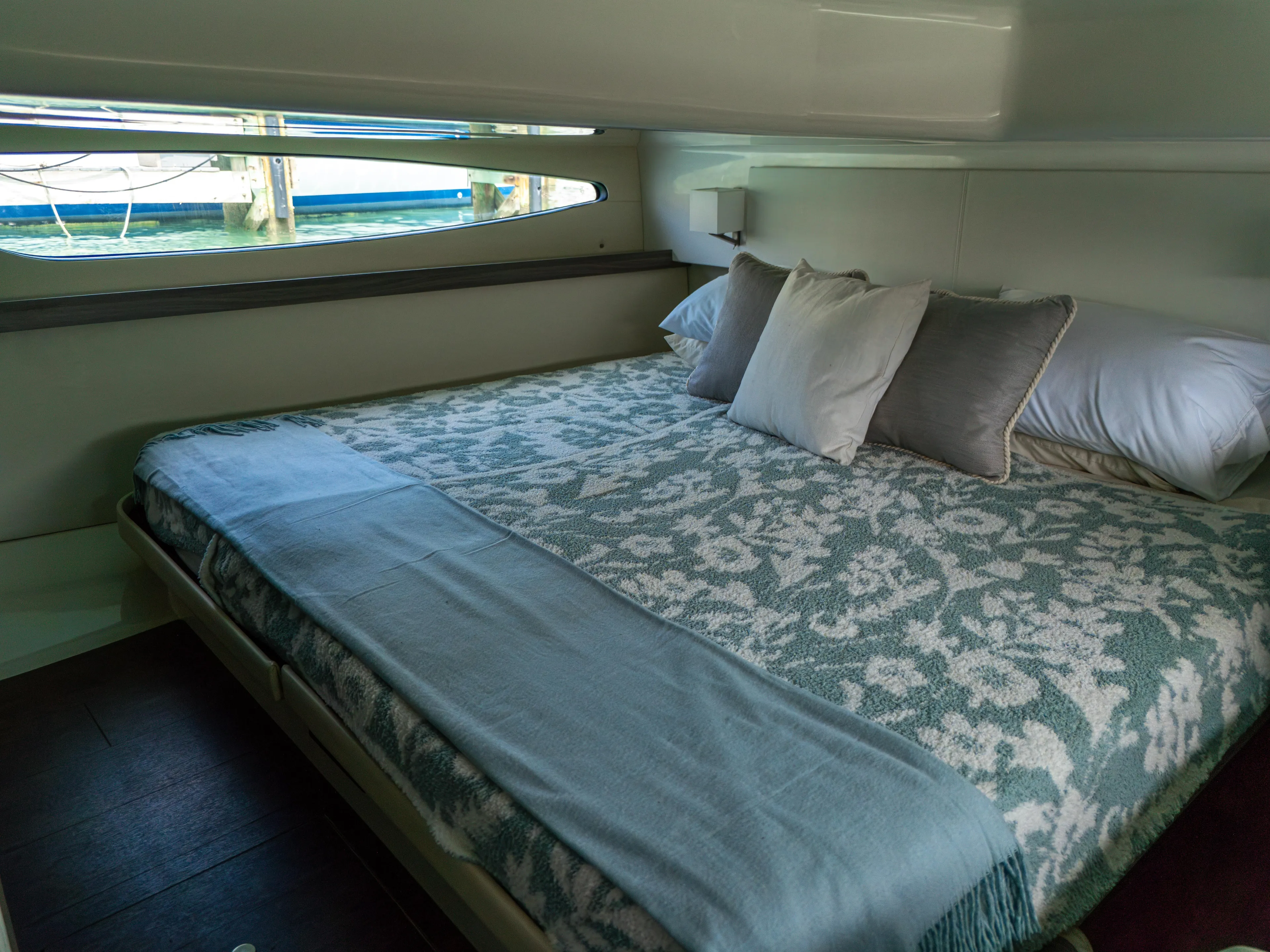  Yacht Photos Pics Luxurious cabin interior of 2023 Regal 38 FXO yacht with elegant bedding.