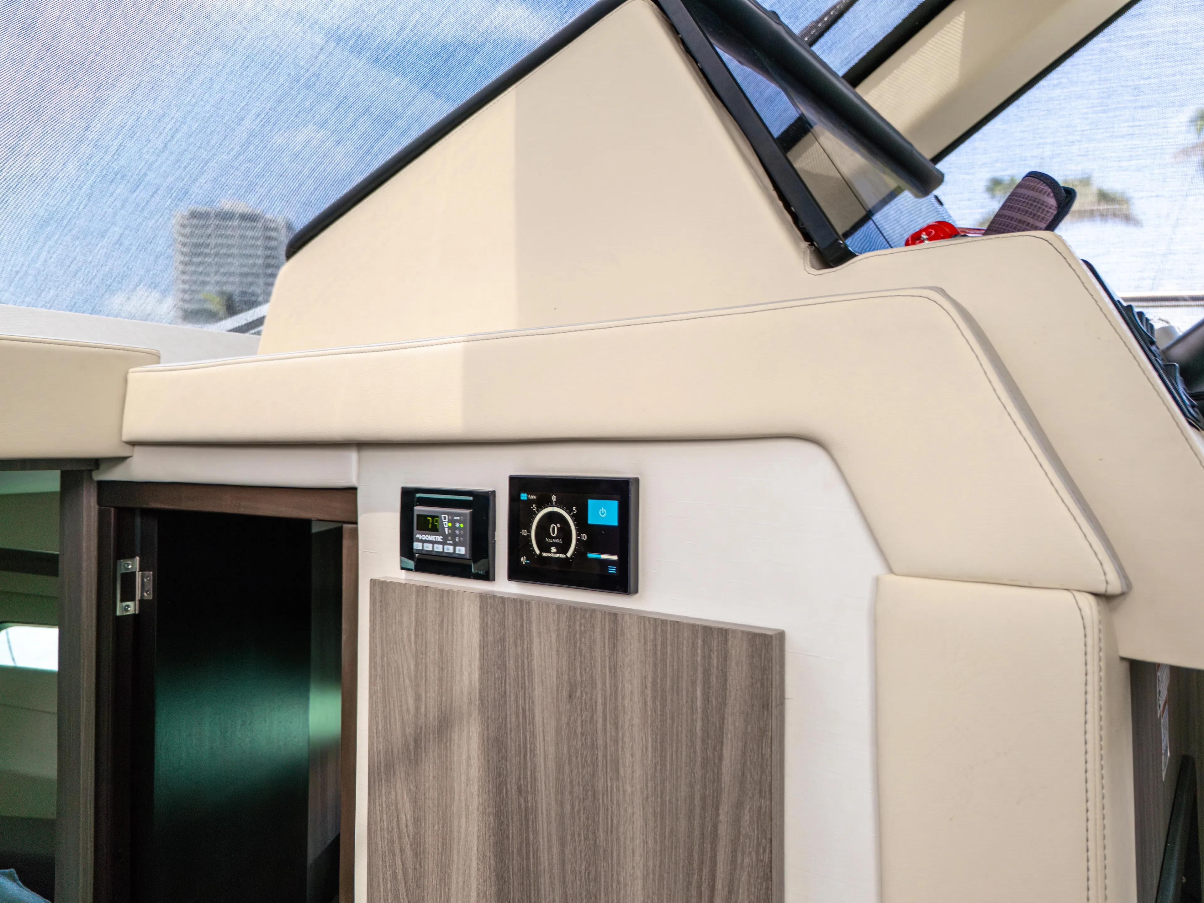  Yacht Photos Pics 2023 Regal 38 FXO yacht interior with modern control panels and sleek design.