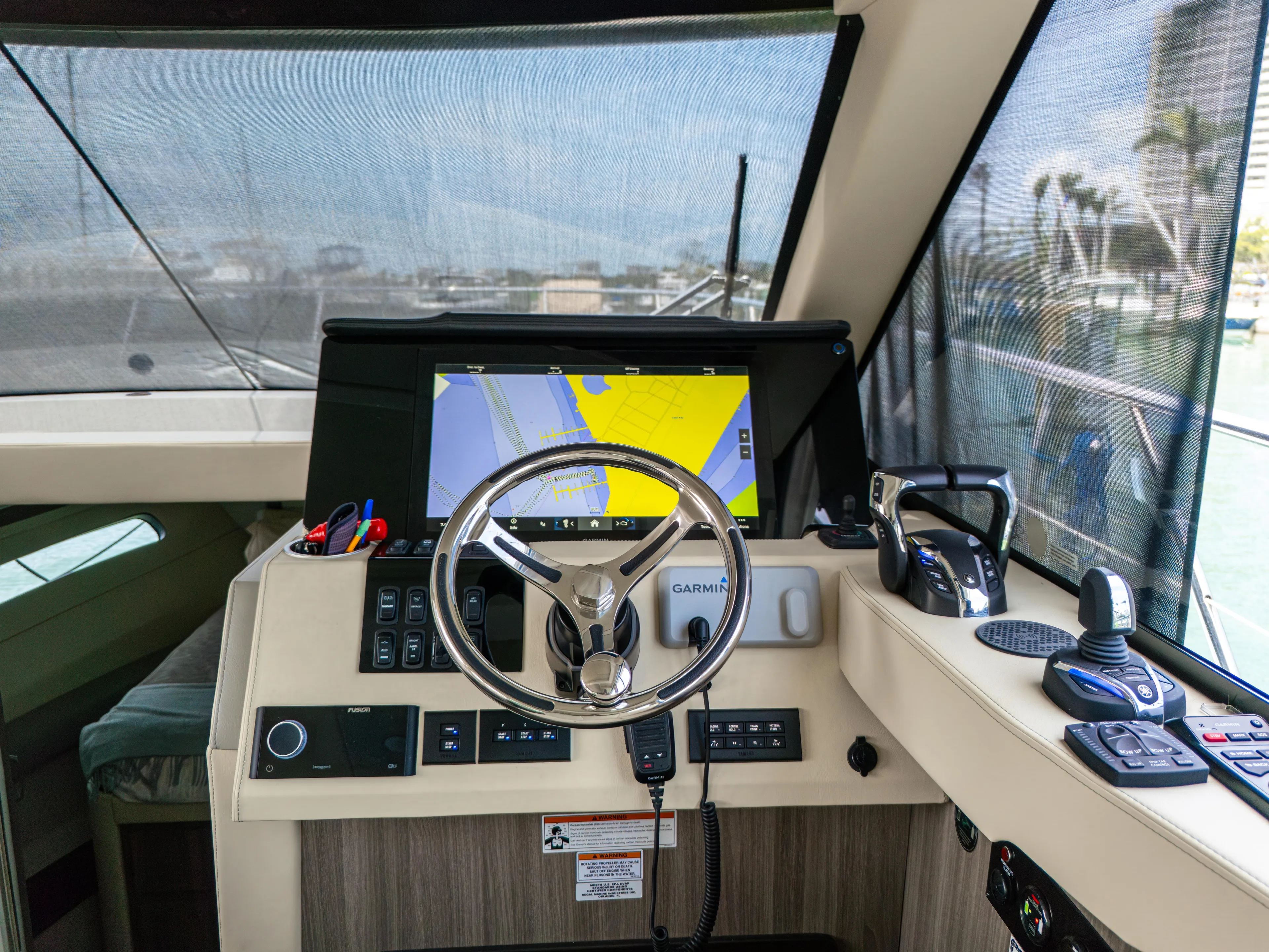  Yacht Photos Pics 2023 Regal 38 FXO helm with navigation display and controls.