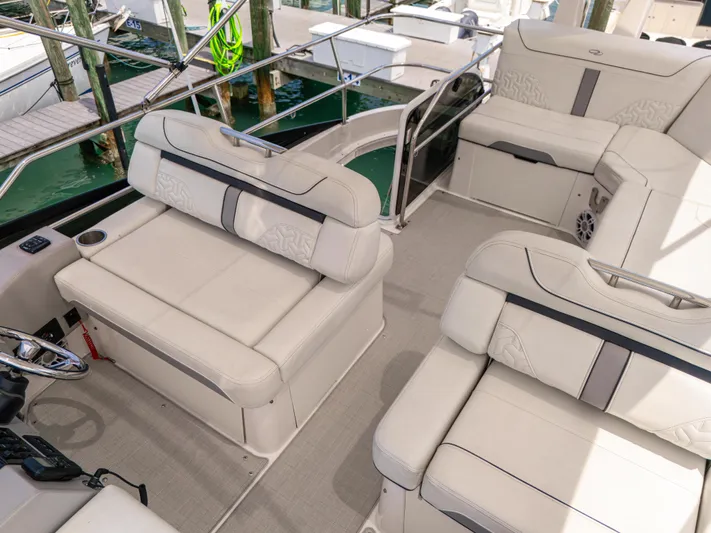  Yacht Photos Pics Luxurious seating on 2023 Regal 38 FXO yacht, featuring elegant white upholstery.
