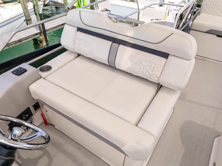  Yacht Photos Pics 2023 Regal 38 FXO boat interior with luxurious beige seating and cup holder.