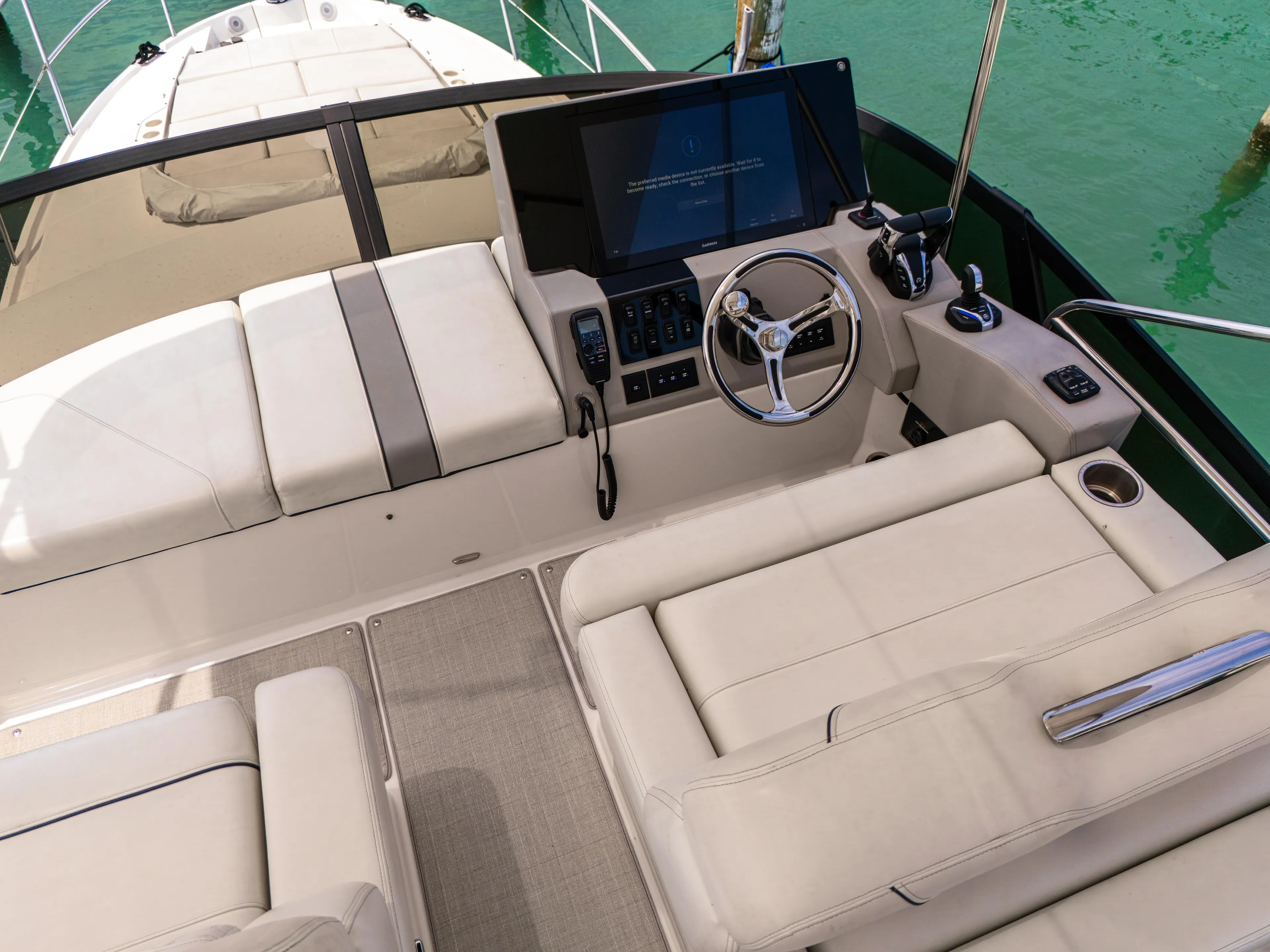  Yacht Photos Pics 2023 Regal 38 FXO yacht helm with luxurious seating and modern controls.