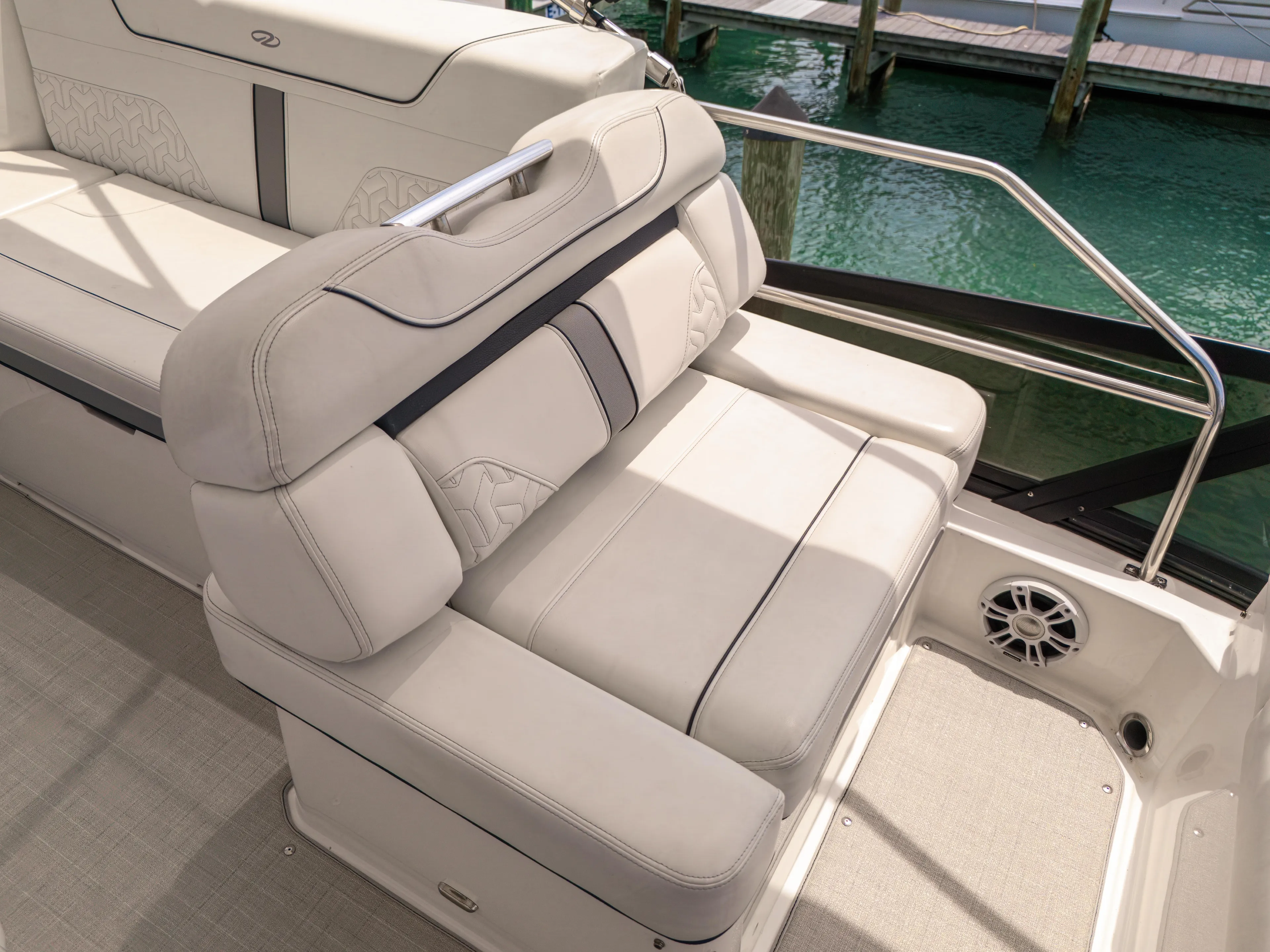  Yacht Photos Pics Luxurious seating on 2023 Regal 38 FXO boat, featuring elegant design and waterfront view.