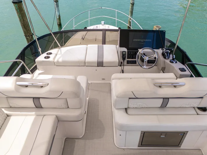  Yacht Photos Pics 2023 Regal 38 FXO yacht helm with luxurious seating and modern controls.