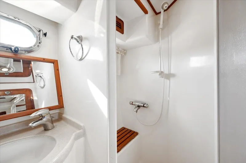  Yacht Photos Pics Bathroom interior of 2003 Selene 53 yacht with shower and sink.