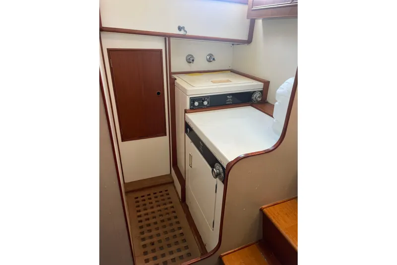  Yacht Photos Pics Laundry area in 1987 Grand Banks 42 Motoryacht with washer and dryer.