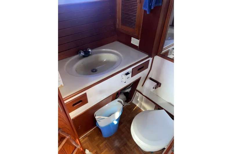  Yacht Photos Pics Bathroom interior of 1987 Grand Banks 42 Motoryacht with sink and toilet.