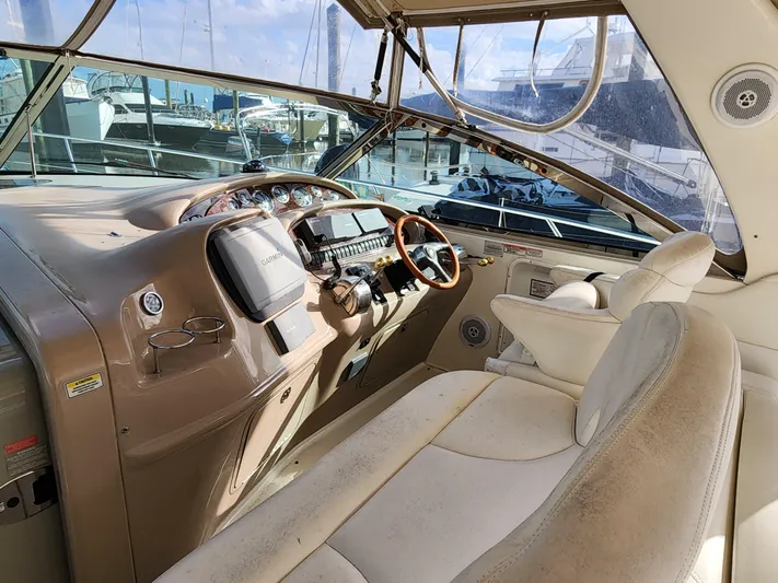  Yacht Photos Pics 2001 Sea Ray 410 Express Cruiser helm with steering wheel and navigation equipment.