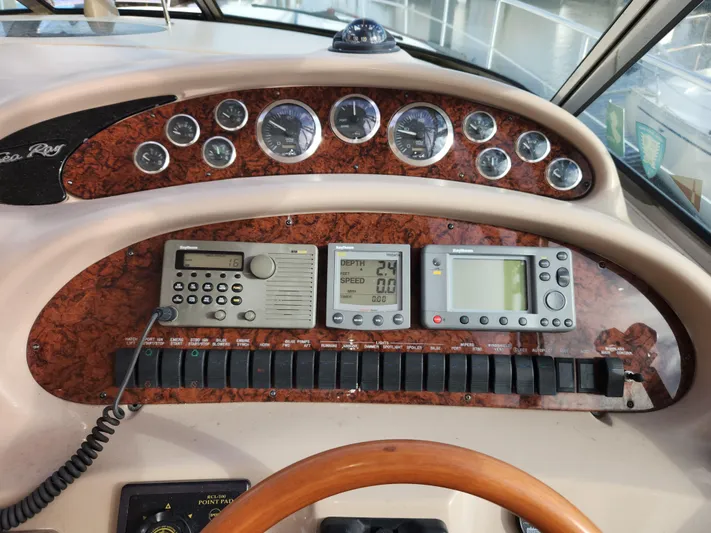  Yacht Photos Pics Control panel of a 2001 Sea Ray 410 Express Cruiser with gauges and navigation equipment.