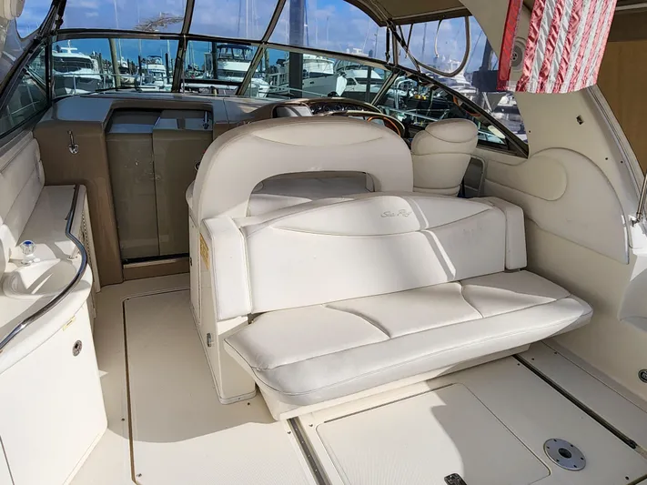  Yacht Photos Pics 2001 Sea Ray 410 Express Cruiser interior with white seating and helm.