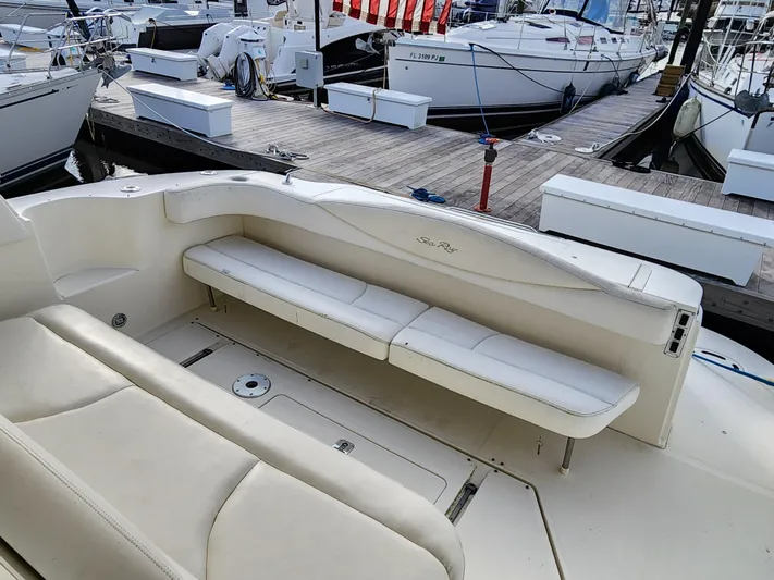  Yacht Photos Pics 2001 Sea Ray 410 Express Cruiser interior with white seating at marina.