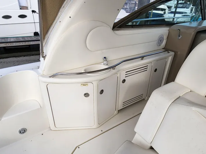  Yacht Photos Pics 2001 Sea Ray 410 Express Cruiser interior with white cabinetry and seating.