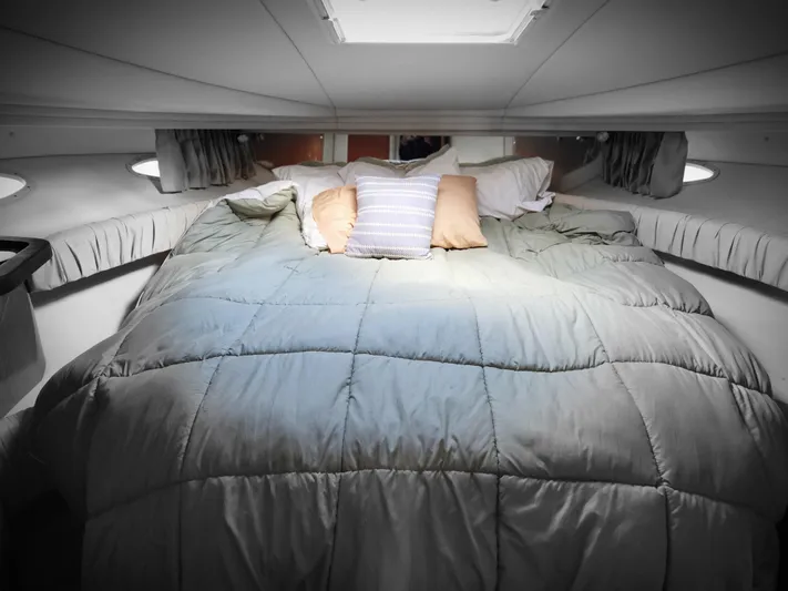  Yacht Photos Pics Cozy cabin interior of 2001 Sea Ray 410 Express Cruiser with plush bedding.