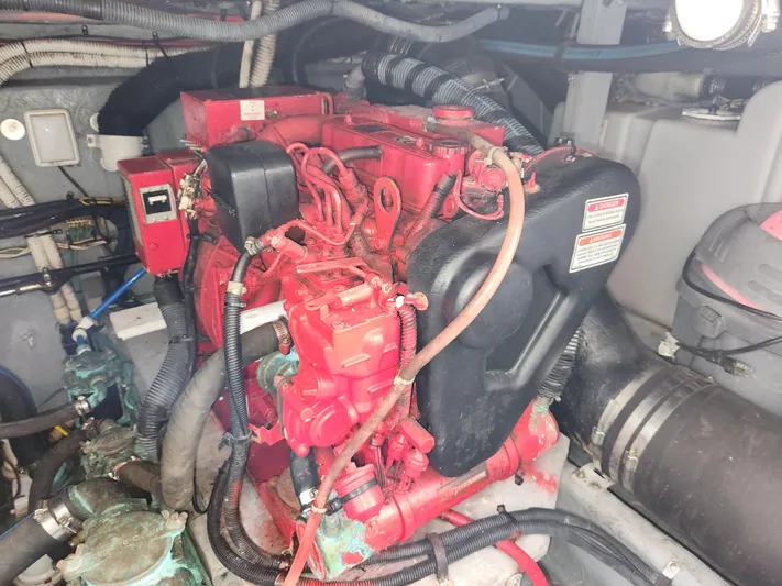  Yacht Photos Pics Engine compartment of a 2001 Sea Ray 410 Express Cruiser, featuring red engine components.