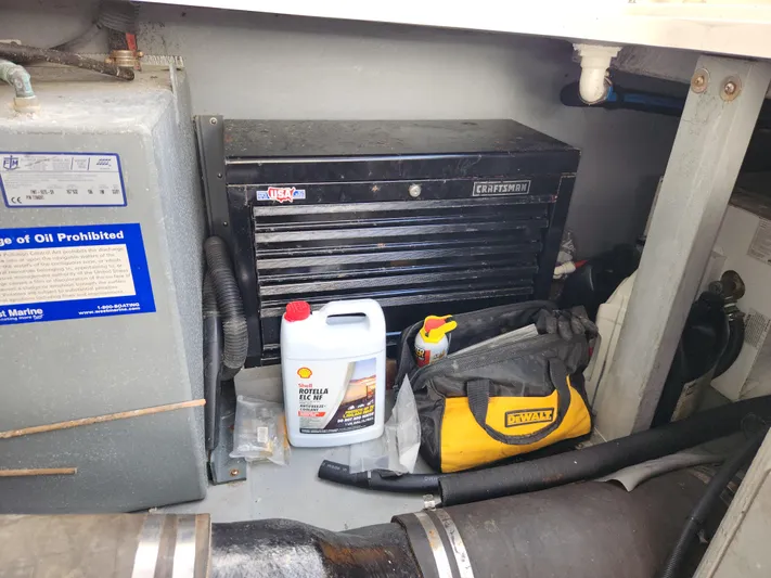  Yacht Photos Pics Engine room of 2001 Sea Ray 410 Express Cruiser with tools and maintenance supplies.