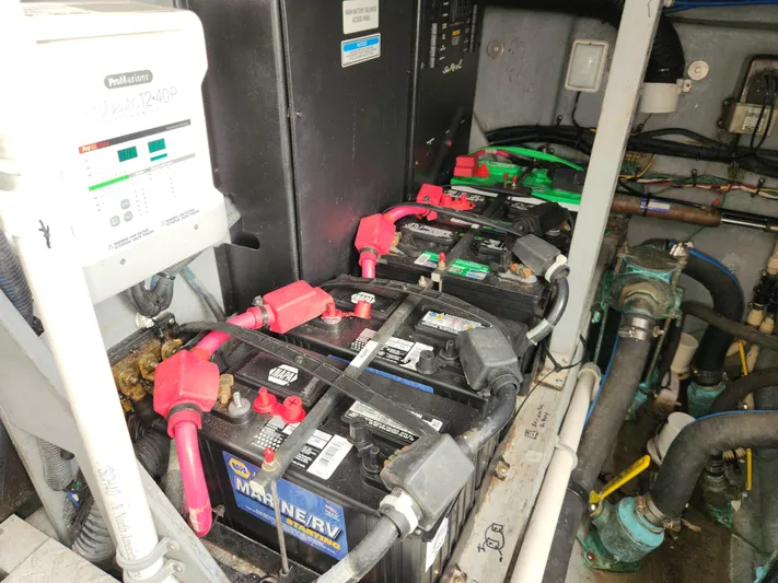  Yacht Photos Pics Engine room of 2001 Sea Ray 410 Express Cruiser with marine batteries and electrical components.