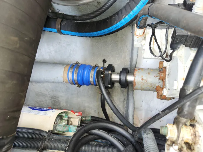  Yacht Photos Pics Engine compartment of a 2001 Sea Ray 410 Express Cruiser, showing hoses and mechanical components.