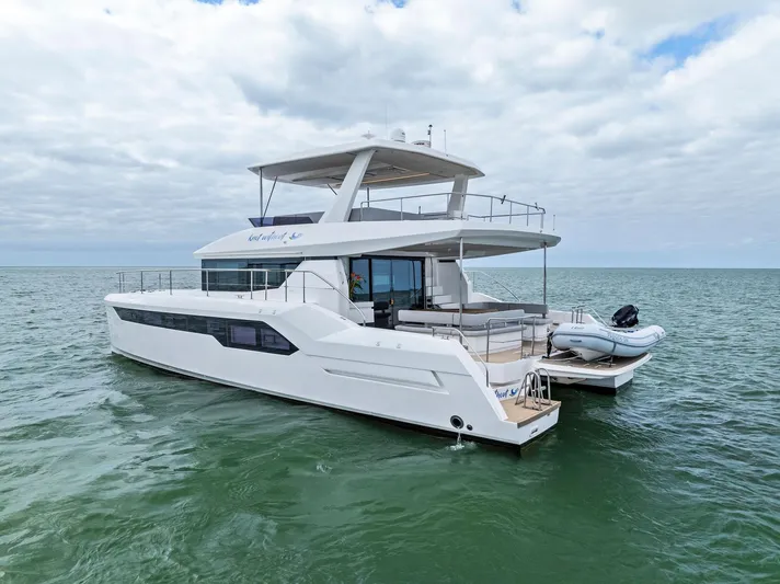 53 Powercat Yacht Photos Pics 2021 Leopard 53 Powercat yacht on open water under cloudy sky.