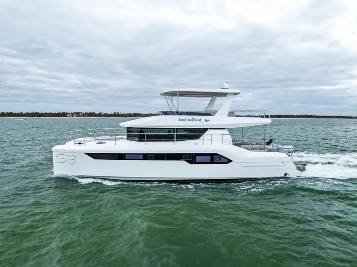 53 Powercat Yacht Photos Pics 2021 Leopard 53 Powercat cruising on open water under cloudy skies.