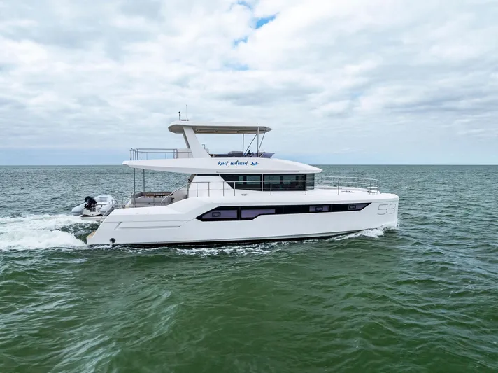 53 Powercat Yacht Photos Pics 2021 Leopard 53 Powercat cruising on open sea under cloudy sky.