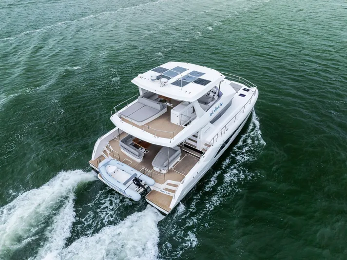 53 Powercat Yacht Photos Pics 2021 Leopard 53 Powercat cruising on open water, aerial view.