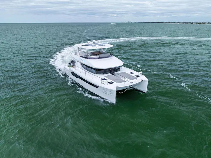 53 Powercat Yacht Photos Pics 2021 Leopard 53 Powercat cruising on open water under cloudy skies.