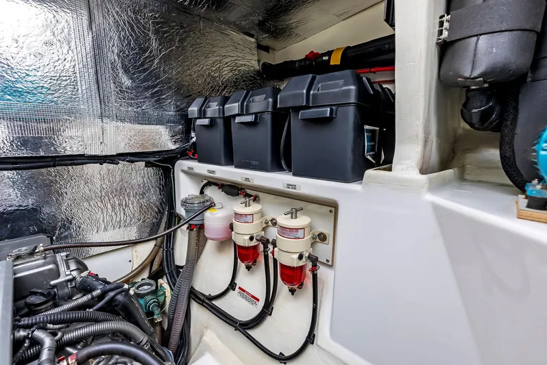 53 Powercat Yacht Photos Pics Engine room of 2021 Leopard 53 Powercat with battery boxes and fuel filters.