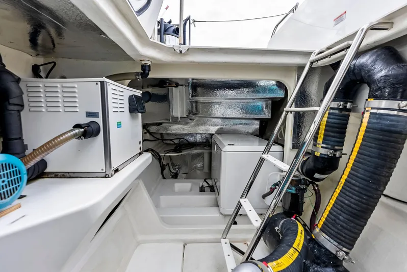 53 Powercat Yacht Photos Pics Engine room of 2021 Leopard 53 Powercat with equipment and ladder.