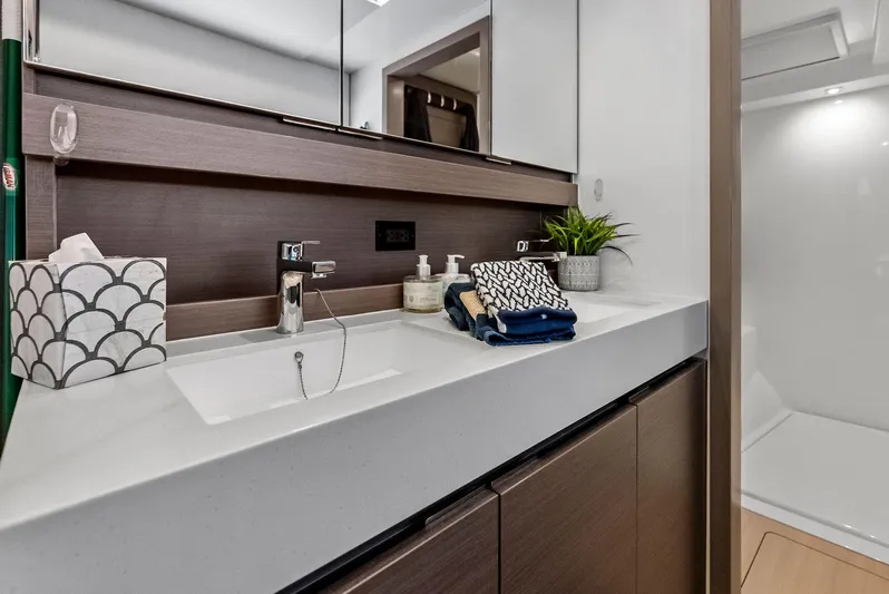 53 Powercat Yacht Photos Pics Luxurious bathroom interior of 2021 Leopard 53 Powercat yacht with modern sink and decor.