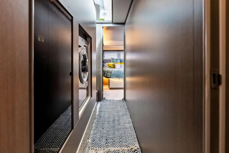 53 Powercat Yacht Photos Pics Leopard 53 Powercat 2021 interior hallway with washer and cozy bedroom view.