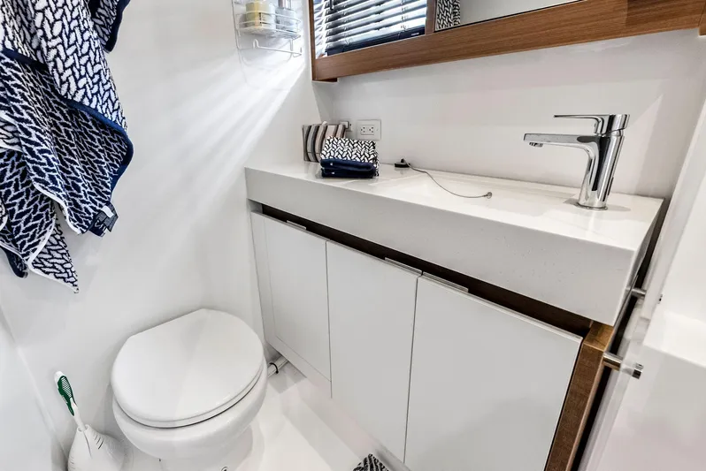 53 Powercat Yacht Photos Pics Modern bathroom in 2021 Leopard 53 Powercat yacht with sleek fixtures and white cabinetry.