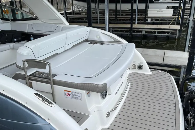  Yacht Photos Pics 2020 Formula 350 Crossover Bowrider with spacious seating and sleek design at a dock.