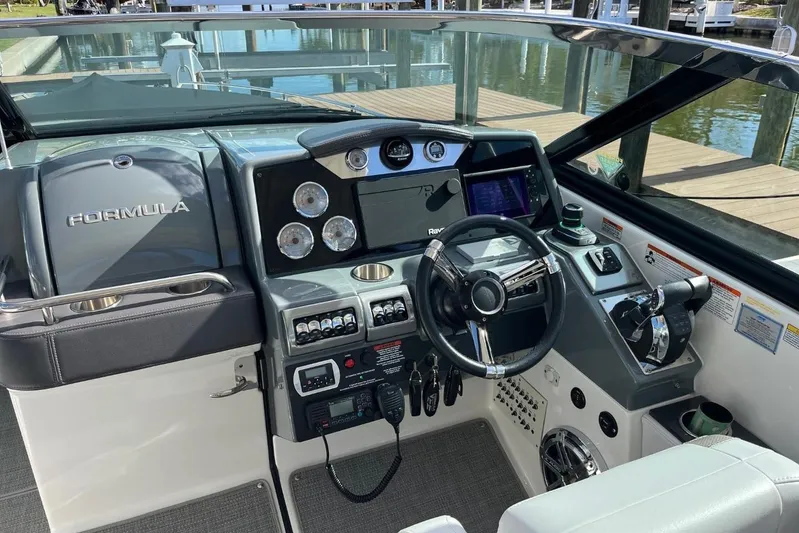  Yacht Photos Pics 2020 Formula 350 Crossover Bowrider helm with modern controls and navigation system.