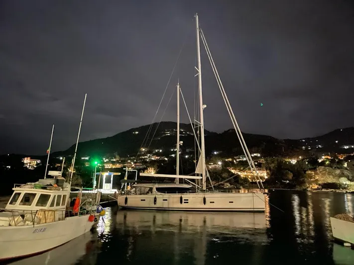  Yacht Photos Pics Sailboat Moody 54 DS 2016 docked at night in a scenic harbor.