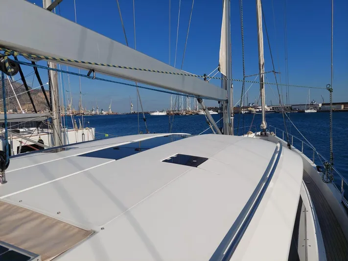  Yacht Photos Pics Sailing yacht Moody 54 DS, 2016 model, docked in a sunny marina.