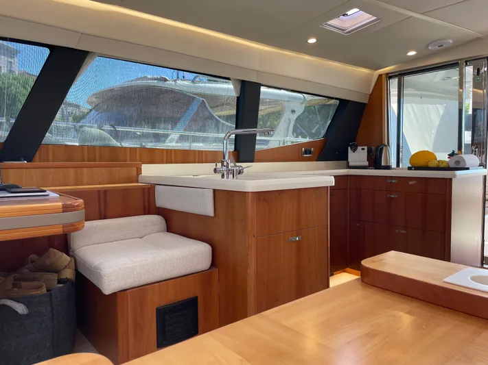  Yacht Photos Pics Luxurious interior of 2016 Moody 54 DS yacht with modern kitchen and seating area.