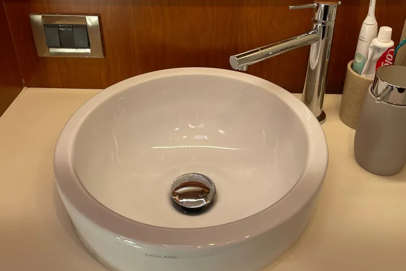  Yacht Photos Pics Modern bathroom sink with chrome faucet on Moody 54 DS yacht, 2016 model.