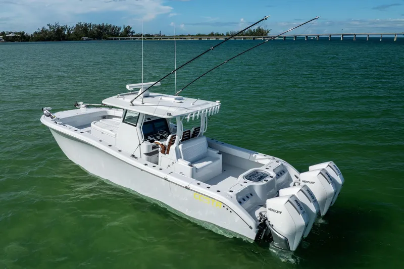  Yacht Photos Pics 2024 Costa Custom Boats 34 SV on water, featuring triple Mercury engines.