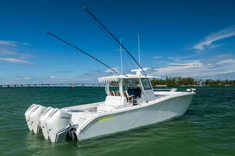  Yacht Photos Pics 2024 Costa Custom Boats 34 SV in open water, featuring triple Mercury engines.