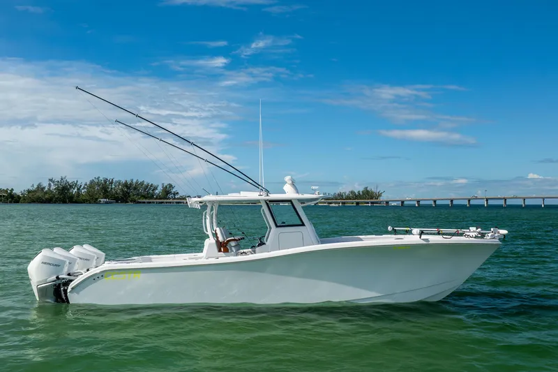  Yacht Photos Pics 2024 Costa Custom Boats 34 SV on calm waters under a clear blue sky.