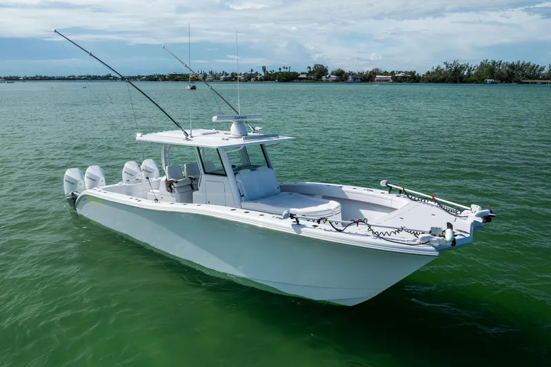  Yacht Photos Pics 2024 Costa Custom Boats 34 SV on calm green water, featuring multiple outboard engines.