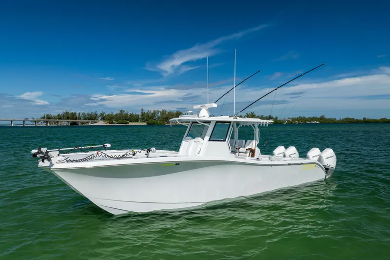  Yacht Photos Pics 2024 Costa Custom Boats 34 SV in serene waters, showcasing sleek design and powerful engines.