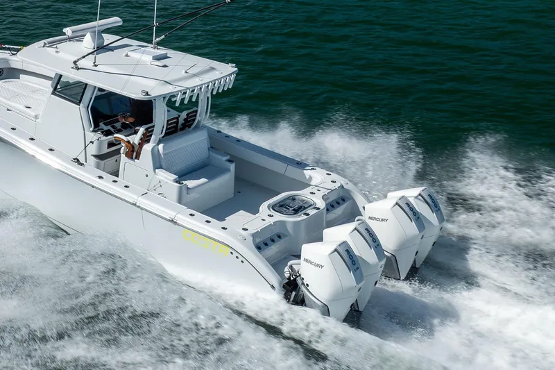  Yacht Photos Pics 2024 Costa Custom Boats 34 SV cruising on water with powerful Mercury engines.